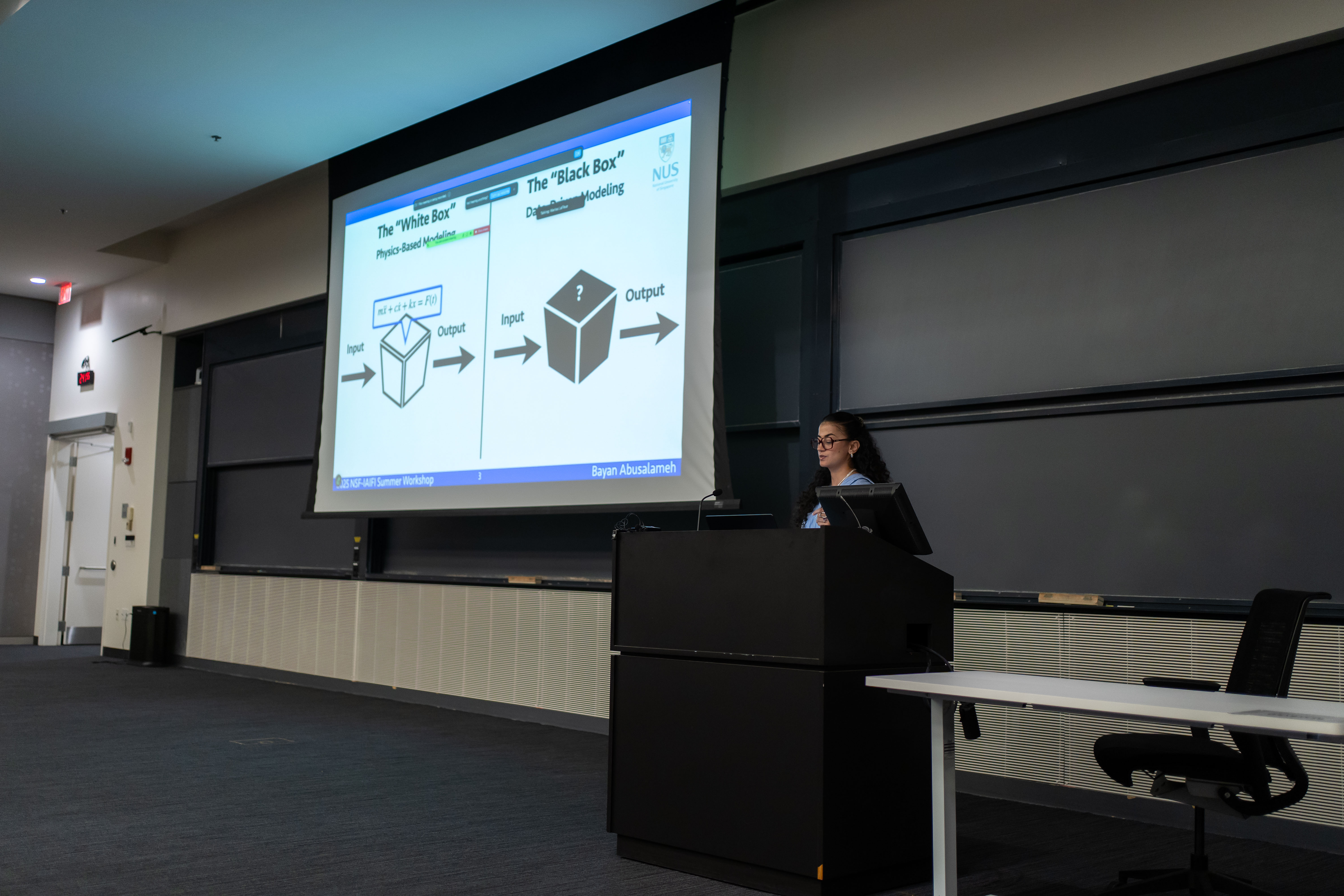 Bayan presenting — white box vs black box slide